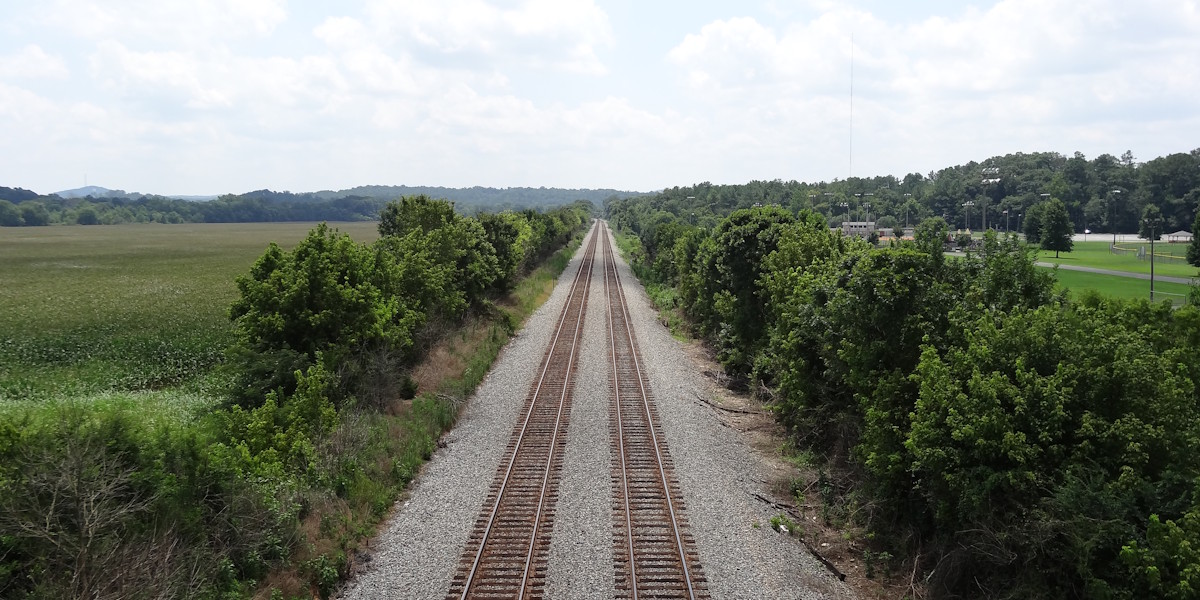 Two employees standing in front of their coffee shop